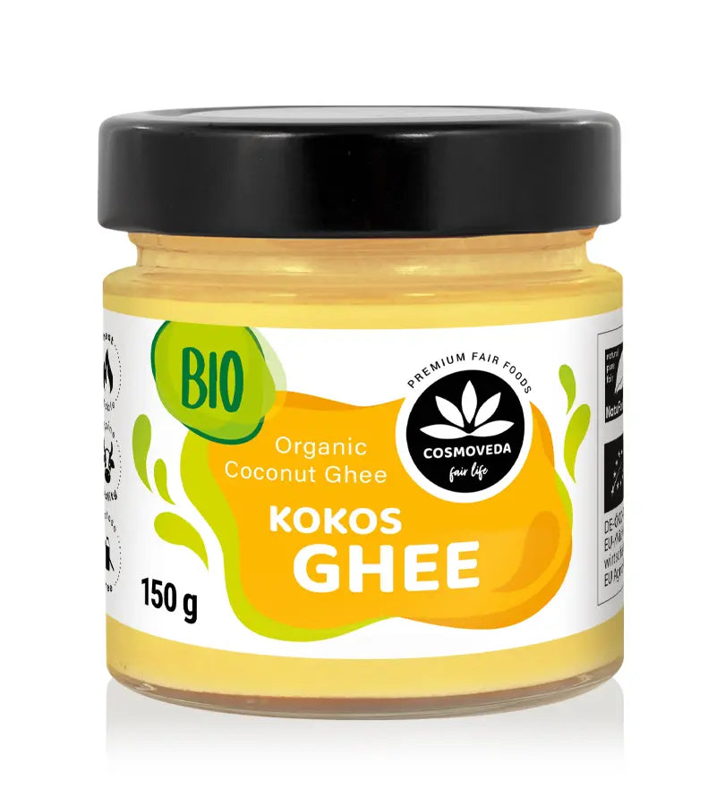 Ein glas organisches cosmoveda ghee mit schwarzem deckel und gelbem etikett ayurvedisches butterfett und ghee wirkung