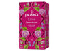 Eine pinke und magentafarbene Schachtel Pukka "Love" Tee, verziert mit Illustrationen von Rosen und Lavendel.