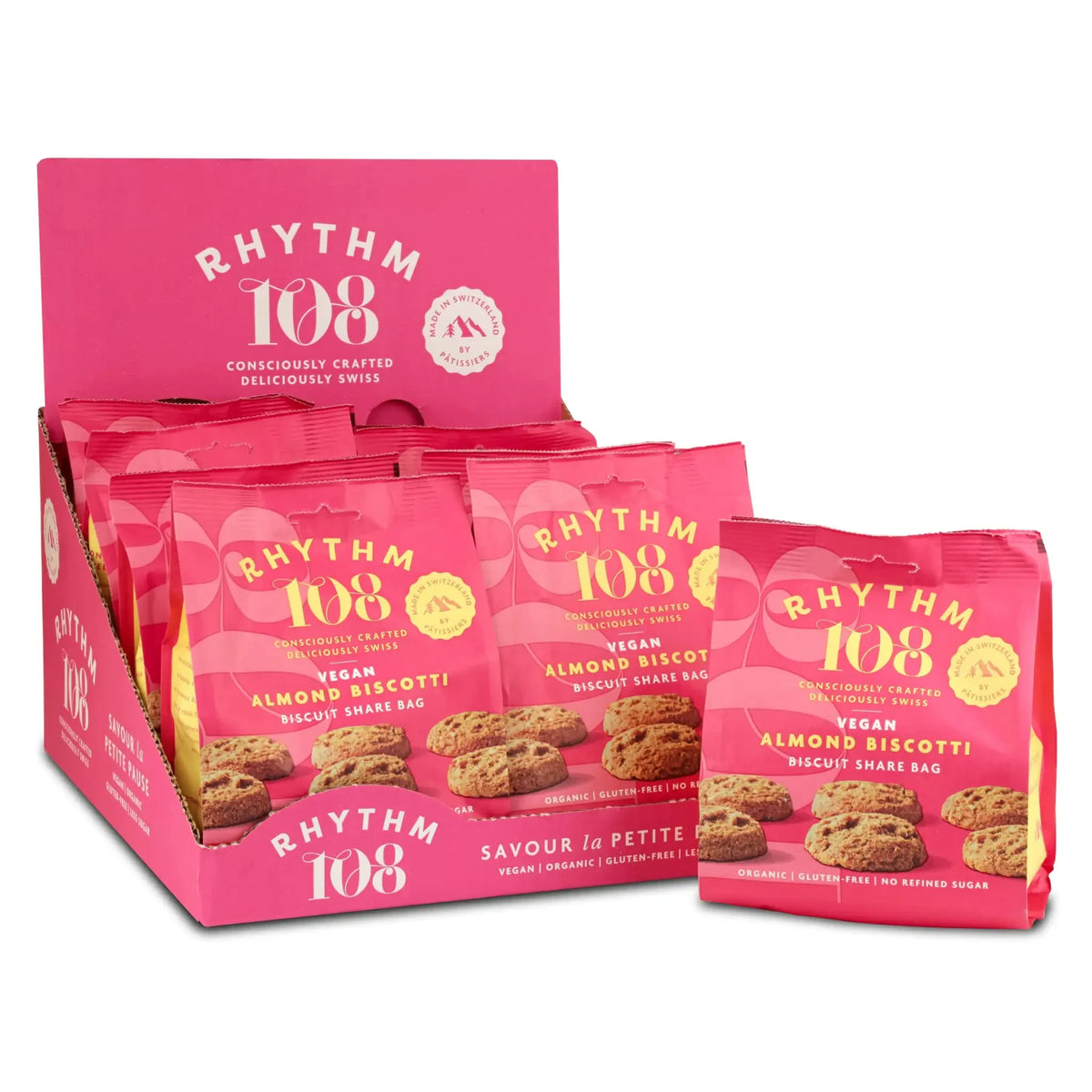 Ein rosa Displaykarton und ein Beutel mit Rhythm 108 Veganen Mandel-Biscotti.