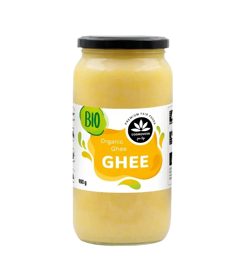 Ein 900g glas mit cosmoveda pure ghee bio, klarglas, schwarzer deckel und gelbem etiket mit grünen akzenten