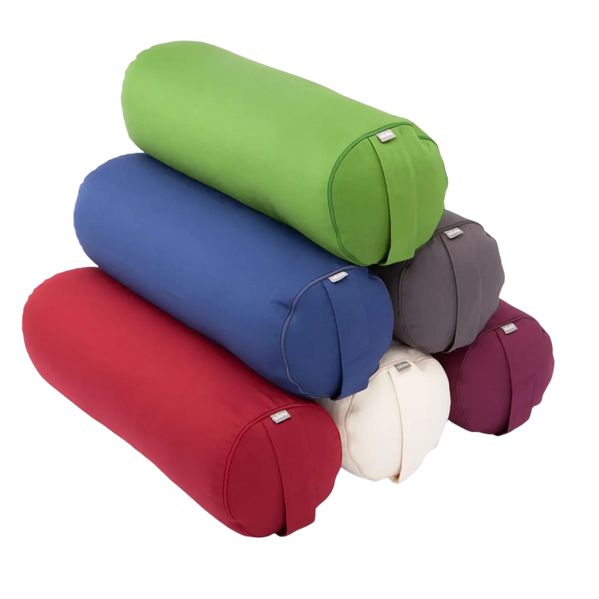 Bodynova Yoga Bolster ECO Dinkel in buntem, zylindrischem Design, ideal für Yoga-Übungen, in grün aufgestapelt