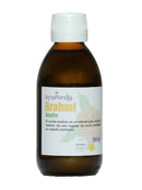 Eine braune Glasflasche mit weißem Etikett. Auf dem Etikett steht "ayurveda Brahmi Aceite" (Ayurveda Brahmi Öl) und die Aufschrift "200 ml". Ein blassgelber Rosenblütenumriss ist im Hintergrund sichtbar.