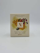 Schachtel für Heidehonig-Feuchtigkeitscreme (Mel de Urze) mit Waben- und Blumendesign.