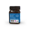 Seitenansicht eines Honigglasetiketts mit Kontaktinformationen, Barcode und der Flagge Nepals.