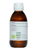 - Das rückseitige Etikett einer braunen Glasflasche "Ayurveda autentico Mostaza negra Aceite" (Schwarzes Senföl). Es nennt "100% biologisches, kaltgepresstes Senföl" als Zutat und empfiehlt die Verwendung als Dressing für Salate und Gemüse.