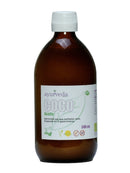 Braune Glasflasche Kokosöl (500 ml) der Marke Ayurveda, vorderseitig beschriftet mit "COCO Aceite", Bio-Zertifizierung und den Angaben "100% Natural, Gluten-Free, OMG".