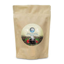 Eine braune Papiertüte mit einem runden Etikett, auf dem „Ancient Purity Pineal Gland Support Chlorine & Fluoride Detox“ steht, auf einem weißen Hintergrund.