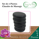 Werbebild für ein Set von fünf schwarzen Basalt-Massagesteinen mit der französischen Beschriftung "Set de 5 Pierres Chaudes de Massage" und den Maßen 6x5x1.8cm