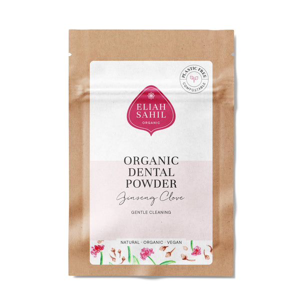Produktfoto eines kompostierbaren braunen Papierbeutels von „Eliah Sahil Organic Dental Powder“ mit der Aufschrift „Ginseng Clove“, mit rotem Logo und einem „Plastic Free“-Stempel.