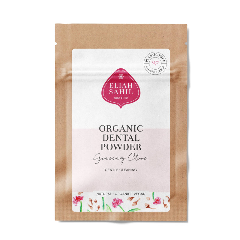 Produktfoto eines kompostierbaren braunen Papierbeutels von „Eliah Sahil Organic Dental Powder“ mit der Aufschrift „Ginseng Clove“, mit rotem Logo und einem „Plastic Free“-Stempel.