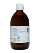 Eine braune Glasflasche Ayurveda Kokosöl mit weißem Etikett. Das Etikett listet 100% biologisches Kokosöl als Zutat, Kochanwendungen, Losnummer E2912/A und ein Mindesthaltbarkeitsdatum 12/2025 auf.