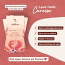 Eine Delikao "Love Tonic Caresse" Milchschokoladenpackung mit Vanille aus Madagaskar. Die Infografik bewirbt das Produkt als gut für das Wohlbefinden, zuckerfrei, ohne raffinierten Zucker, in Frankreich hergestellt und ohne Sojalecithin.