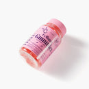 Schrägansicht einer rosa Myga Collagen Gummies-Flasche vor weißem Hintergrund.