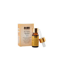 Eine goldene Schachtel und eine kleine Glasflasche mit einer Pipette, beides für NIMI AYURVEDA Anu Thailam, ein ayurvedisches Massageöl, mit einem Inhalt von 10 ml.