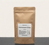 Dhanwantaram Guliga von Midgards Ayurveda mit 100 ayurvedischen Kräutertabletten in einer wiederverschließbaren Kraftpapierverpackung.