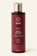 Flasche Khadi Naturkosmetik Ayurvedisches Elixier Shampoo Amla Volume (Amazing) mit dunkelrotem Etikett und goldenem Verschluss.