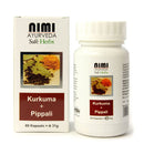 Eine weiße Schachtel und eine weiße Plastikflasche mit NIMI AYURVEDA Kurkuma + Pippali Kapseln. Das Etikett zeigt Kurkumapulver und Pippali-Früchte, den Inhalt von 60 Kapseln und das Gewicht von 31 g.