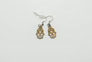 Boucles d'oreilles Hamsa avec lotus et Om – symbolisme et style combinés