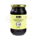 Ein glas mit goldfarbigem deckel enthält dunkle amberfarbene amalaki rasayana ayurvedische fruchtpaste mit vitamin c