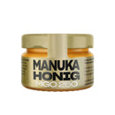 Glas ANUK Manuka-Honig MGO250, natürlicher Honig mit MGO 250, in einem Glas mit Honig und Bienenwabe.