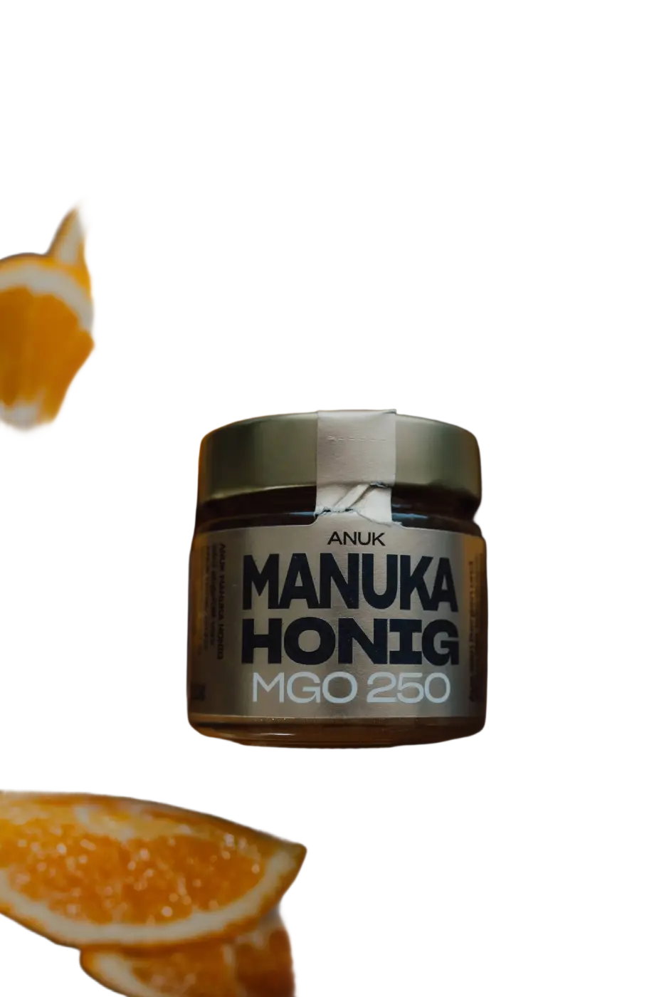 Glas mit ANUK Manuka-Honig MGO250, naturbelassener Honig in Metallverschlussdeckel, sichtbar auf der Verpackung.