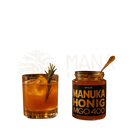 Ein glas anuk manuka honey mgo400+ mit schwarzem etikett und goldener schrift von the mana shop