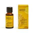 Apeiron bio-pflegeöl jojoba-teebaum 30ml natürliche pflege in bernsteinfarbenem glas mit schwarzem verschluss und gelber verpackung