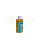 A clear glass bottle of apeiron keshawa herbal hair and beard oil with golden-yellow oil and teal botanical label