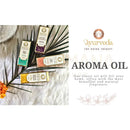 Vier rechteckige aromaöl aqua oud flaschen von song of india mit bunten etiketten und goldfolie auf weißer oberfläche
