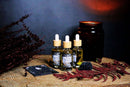 Ätherisches Lilith Oil Ritualöl von Ayamani Naturals mit Mondstein- und Tigeraugenkristallen, für feminines Wohlbefinden.