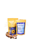 Gelbe pouch mit ayamani naturals dritte auge kräutertee psychische träume 30g und goldenem blumenmuster