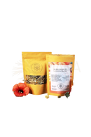Zwei gelbe pouches ayamani naturals sakralchakra kräutertee mit durchsichtiger fenster- und orangenem etikett wellness drink