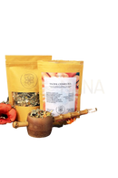 Yellow pouch of ayamani naturals sacral chakra herbal tea with clear window showing dried herbs and orange white label