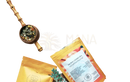 A vibrant orange and white pouch of ayamani naturals sacral chakra herbal tea with floral label for wellness drink