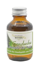 A small amber glass bottle with silver cap and white label displaying ayurveda rhyner gandusha thaila bio 100ml mouthwash oil