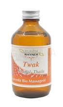 Amber glasflasche mit silberkappe und orange-weißer etikette ayurveda rhyner twak thaila ayurveda massageöl bio 250 ml