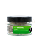 Klarer glasbehälter mit schwarzem deckel und weißen kapseln bio trikatu kapseln ayurveda trikatu für stoffwechsel