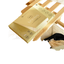 A pale yellow bamboozy x cosmeau spring laundry box with activated by friction eco-friendly detergent sheets