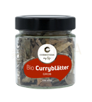 Ein klarer glasbehälter mit bio curry blättern von cosmoveda zur unterstützung von verdauung und doshas balance