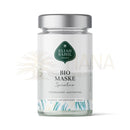 Ein klarer glasbehälter mit silbernem deckel enthält elijah sahil bio gesichtsmaske spirulina mit algenextrakt und heilender tonerde