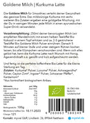 Die rückseite der bio goldene milch latte 100g packung von myvial mit deutschen zutaten und zubereitung im mana shop