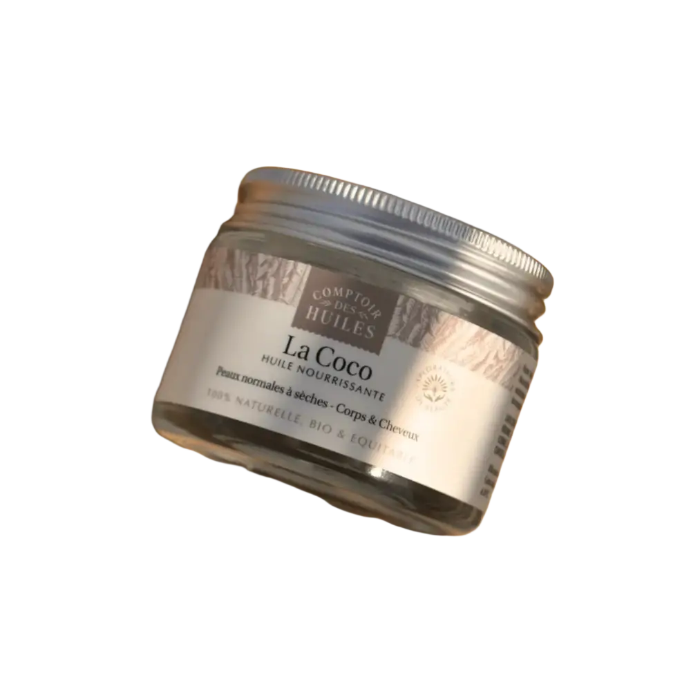 Bio-Kokosöl von Comptoir des Huiles, flüssiges Körperöl und Haarpflege in einer transparenten Flasche, natürliche Inhaltsstoffe sichtbar