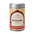 Ein zylindrisches bio koriander gemahlen gewürzdöschen mit silbernem metallverschluss und rotem beigen ayurveda etikett