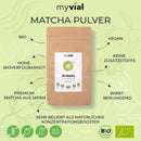 Braune papierverpackung bio matcha pulver 100g von myvial mit weißem etikett grünem herz logo vegan bio matcha aus japan für achtsame energie