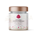 Ein klares glas mit bio zahnpulver ginseng in ginseng tooth powder geschmack mit rose gold deckel und pflanzlicher kraft label