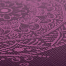 Yogamatte Leela Collection Mandala Aubergine von Bodynova mit buntem Mandala-Design auf lila Unterlage