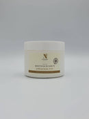 Weißer Tiegel mit D'NATUREZA Sheabutter vor einem schlichten weißen Hintergrund.