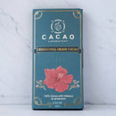 Zeremonieller Kakao Cacao mit Hibiskus und Kardamom in 100g Verpackung, von Cacao Lab, mit Luftelement und bunten Kräutern.