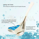 Caudale gesichts-gua sha massager aus silbernem edelstahl mit weißem griff und blauer gelfüllung zur lymphdrainage und gesichtskonturenpflege