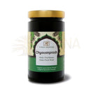 Black glass jar with gold lid and green label of classic ayurveda chyavanprash amla fruit paste supplement made from herbs from mana shop